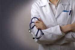 Doctor with a stethoscope in the hands arms crossed