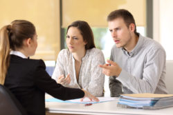 Couple looking upset and confused regarding the class action filed against Canadian insurers who refuse to pay businesses for COVID-19 losses.