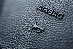 up close shot of an airbag label regarding several airbag recalls by transport Canada
