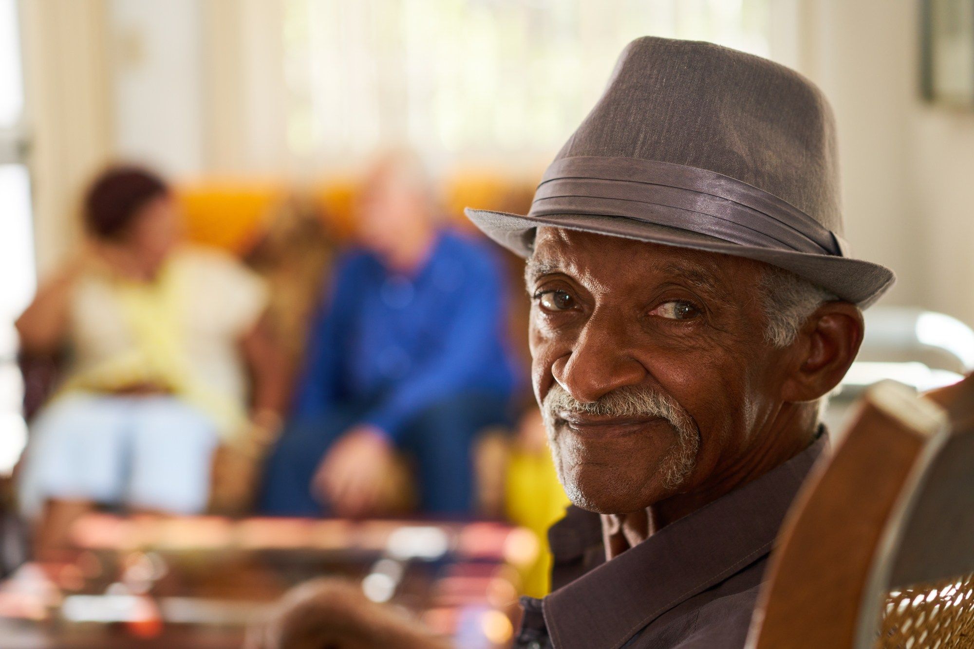 Senior man looking concerned in nursing home regarding the Lundy Manor class action lawsuit filed over its lack of COVID-19 response