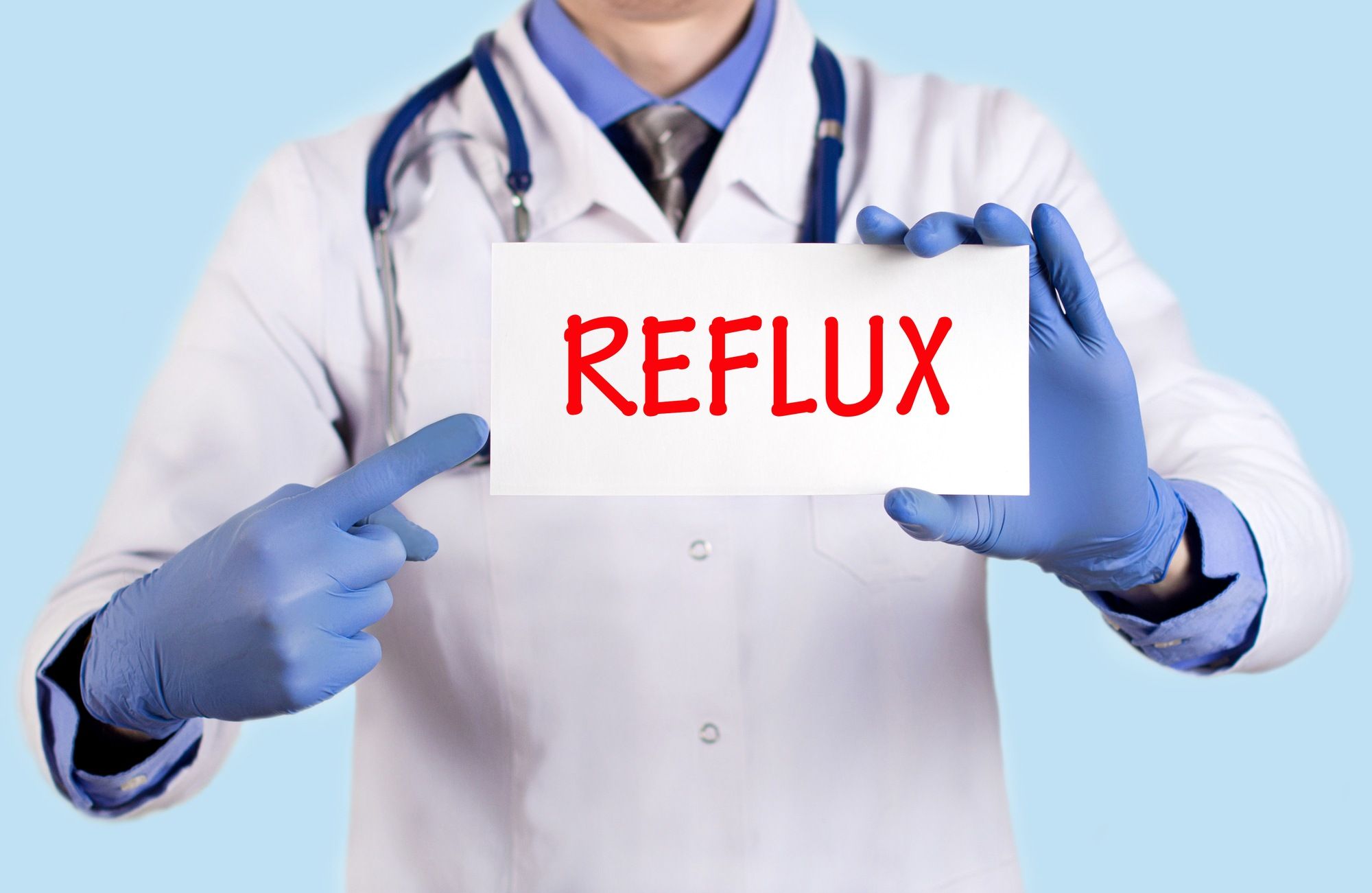 Doctor holding a reflux sign regarding the Zantac class action lawsuit over cancer risk.