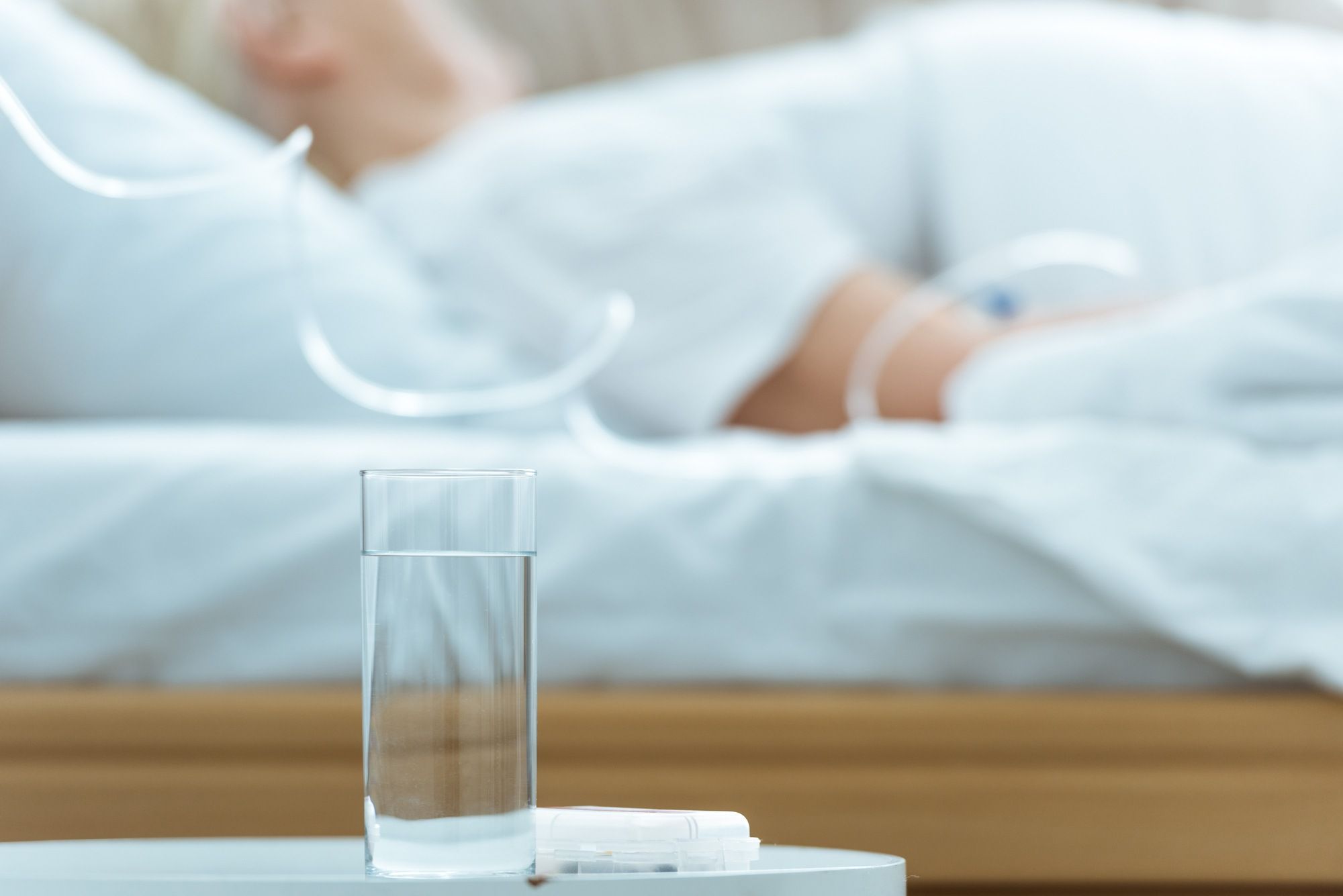 elderly person lying in bed regarding the Revera class action lawsuit over the nursing home's response to COVID-19