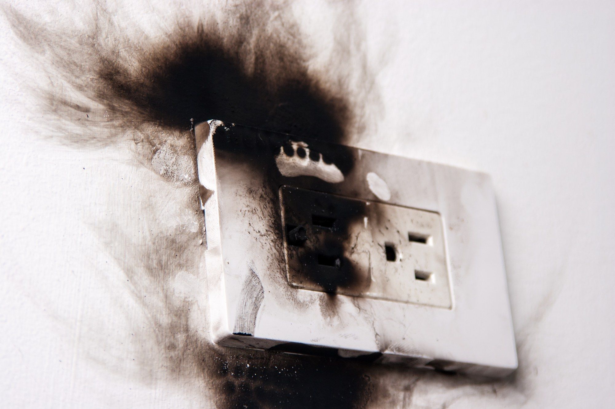Burned outlet regarding products recalled by Health Canada over electric shock hazard risks