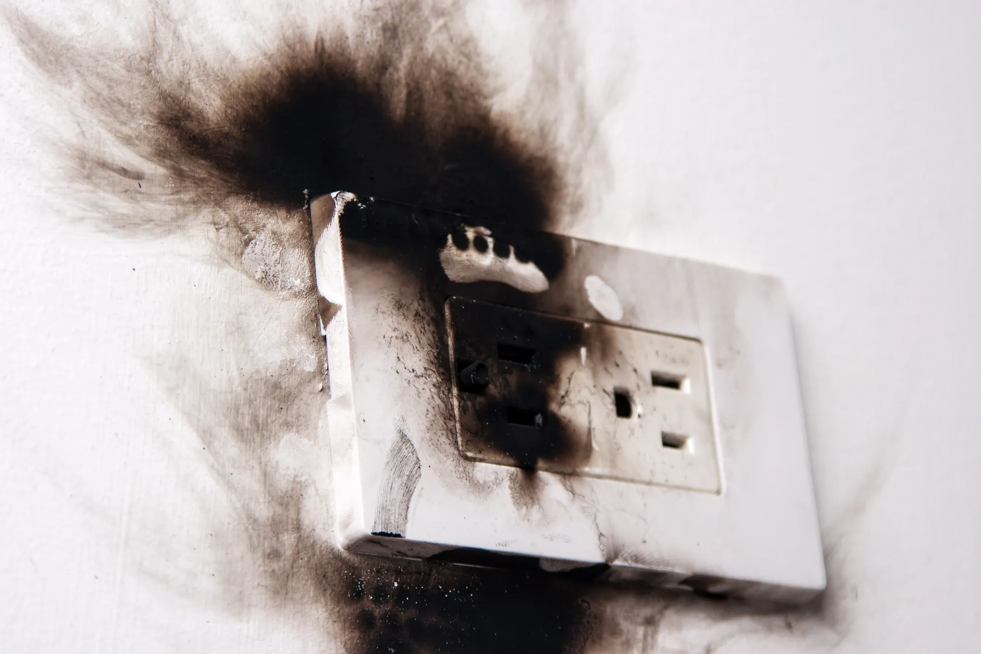 Burned outlet regarding products recalled by Health Canada over electric shock hazard risks