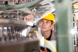 engineer checking a product during manufacture to avoid defects