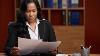 Lawyer looking at multiple cases regarding information on Mass Tort