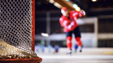 A blurred shot of a hockey player on the ice regarding the CHL abuse and hazing class action lawsuit filed