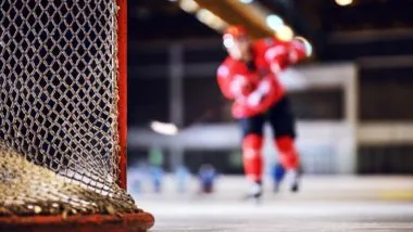 A blurred shot of a hockey player on the ice regarding the CHL abuse and hazing class action lawsuit filed