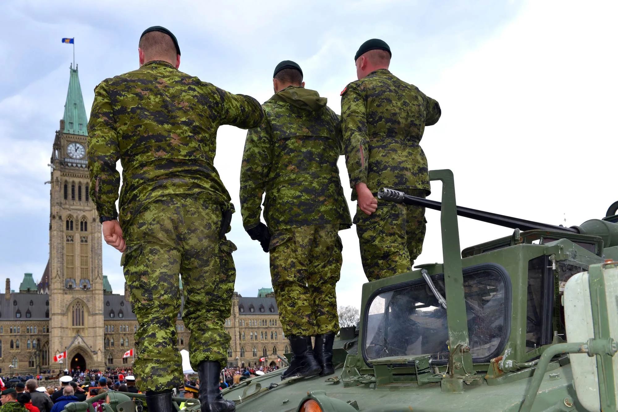 Canadian armed forces soldiers saluting regarding the sexual misconduct class action lawsuit settlement
