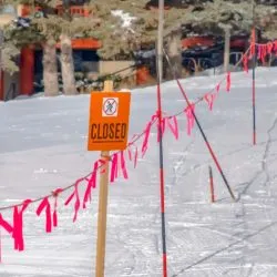 A closed sign regarding the ski pass refund class action lawsuit filed