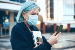 Ontario woman reading news about COVID-19 sharing information 