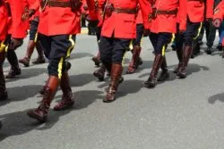 RCMP officers marching regarding the RCMP racism class action lawsuit filed