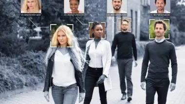 PEople walking with their faces in color regarding the facial recognition RCMP class action lawsuit filed