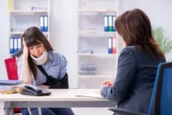 injure woman looking upset regarding information on long term disability claims in Canada