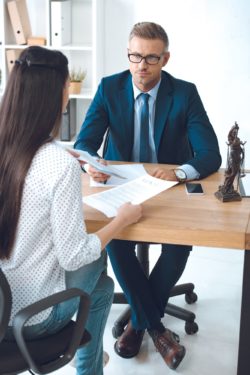 Lawyer working with client regarding information on Manulife long term disability insurance