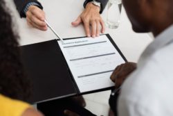 cropped shot of paperwork regarding what to do if your long-term disability insurance claim was denied