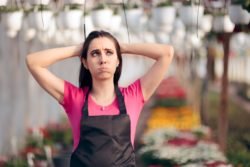 Florist looking stressed regarding the Aviva class action lawsuit filed 