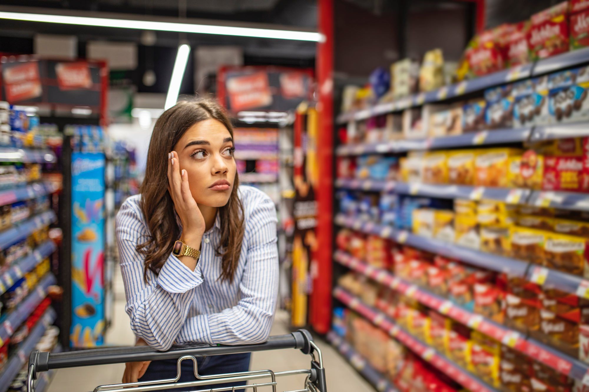 woman shopping amid mass product recalls in Canada