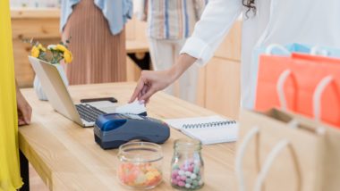 shopkeeper swiping credit card potential privacy breach