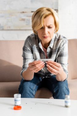 upset woman with medical marijuana regarding the Oganigram class action lawsuit