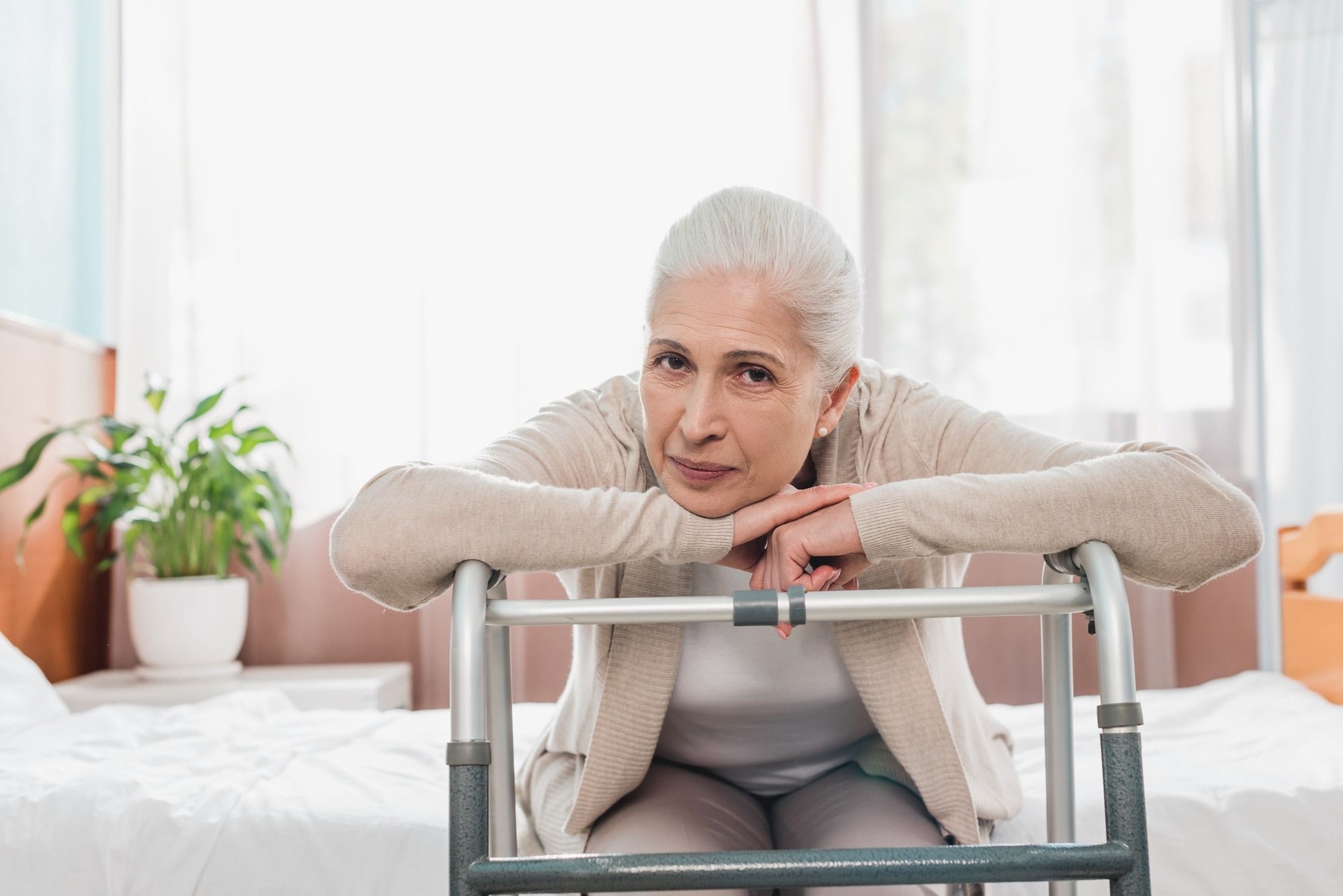 Woman with a walker regarding information on Great West Life insurance company