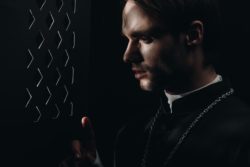 Clergy man in confession regarding the Archdiocese of Vancouver class action lawsuit filed