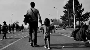 Refugees walking regarding the Roma refugees asylum class action lawsuit settlement
