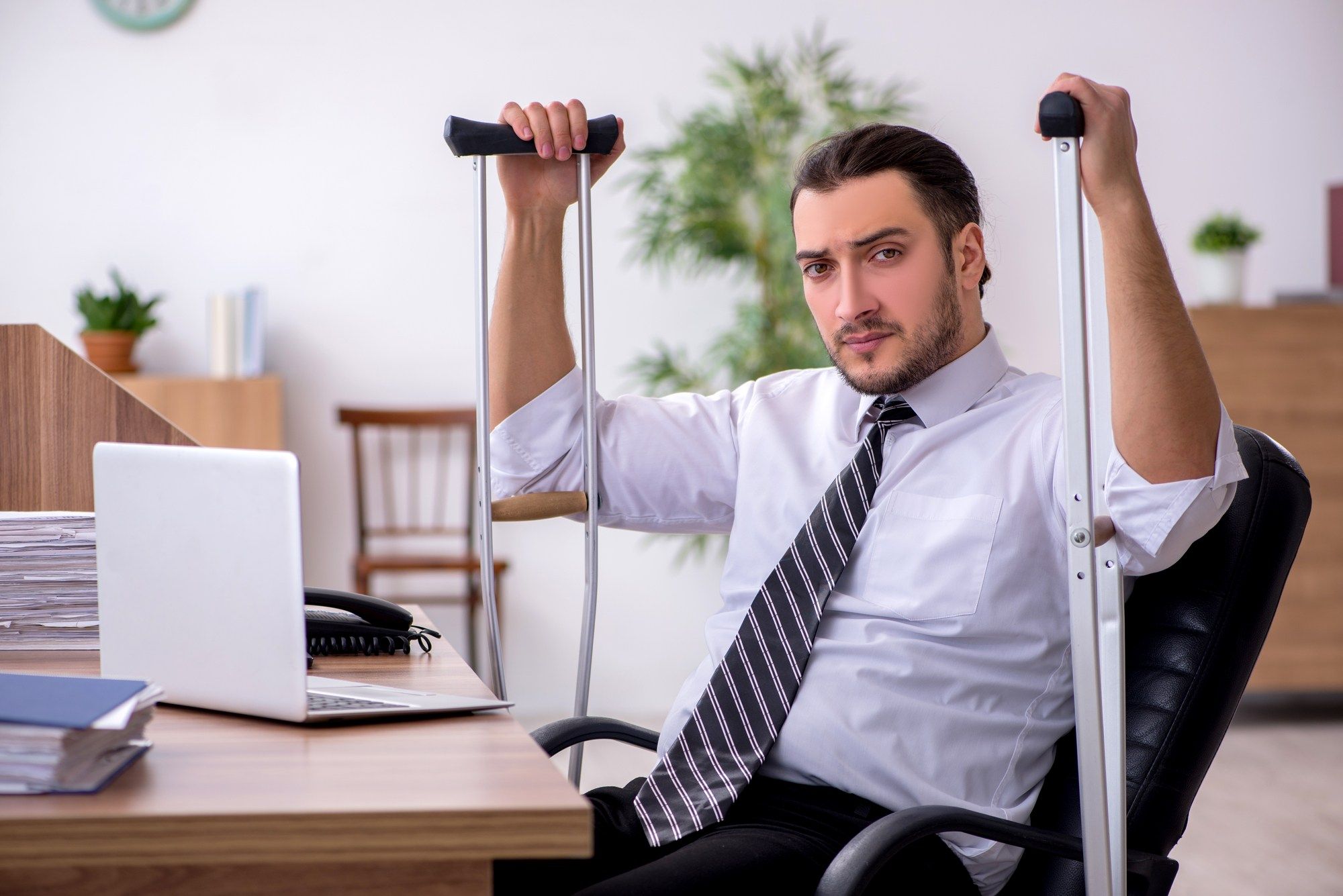 upset injure man regarding information on long-term disability insurance claims being denied