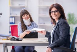 Injure woman with lawyer regarding information on why long-term disability claims are denied 