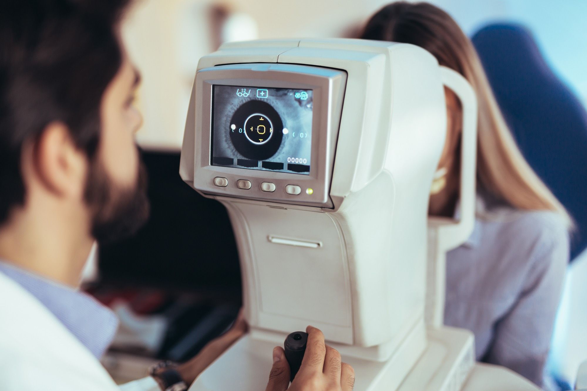 optometrist checking for eye disorders caused by Elmiron