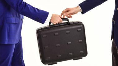 People passing briefcase regarding the immigration lawyer fraud class action lawsuit