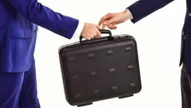 People passing briefcase regarding the immigration lawyer fraud class action lawsuit