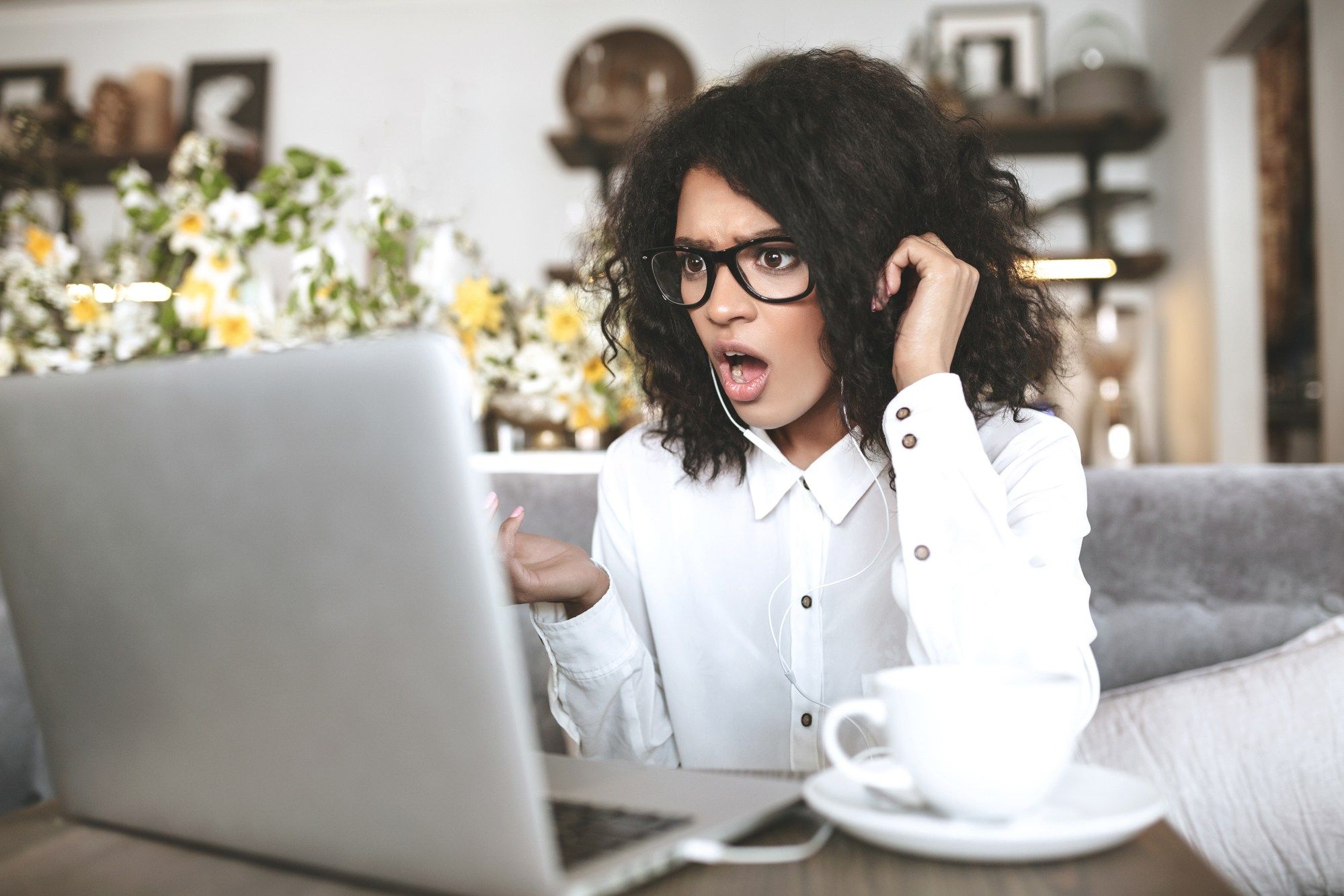 woman reading shocking news regarding information on what to do if your employee benefits LTD insurance is revoked