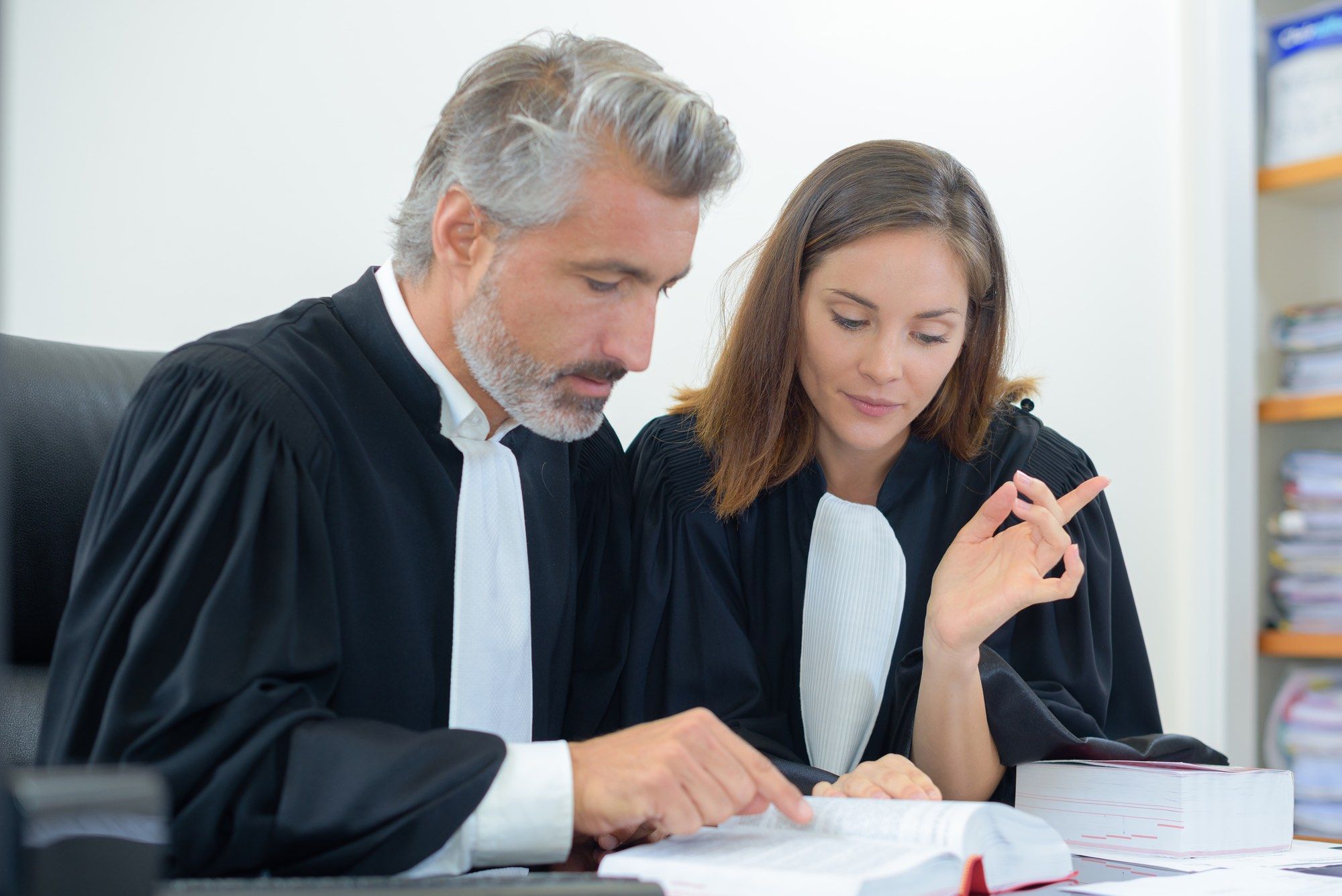 Quebec lawyers reading civil code of Québec amendments on sexual assault statute of limitations