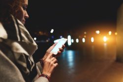 woman using iphone regarding the LinkedIn app privacy class action lawsuit
