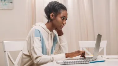 Woman using laptop regarding the Google incognito mode class action lawsuit filed