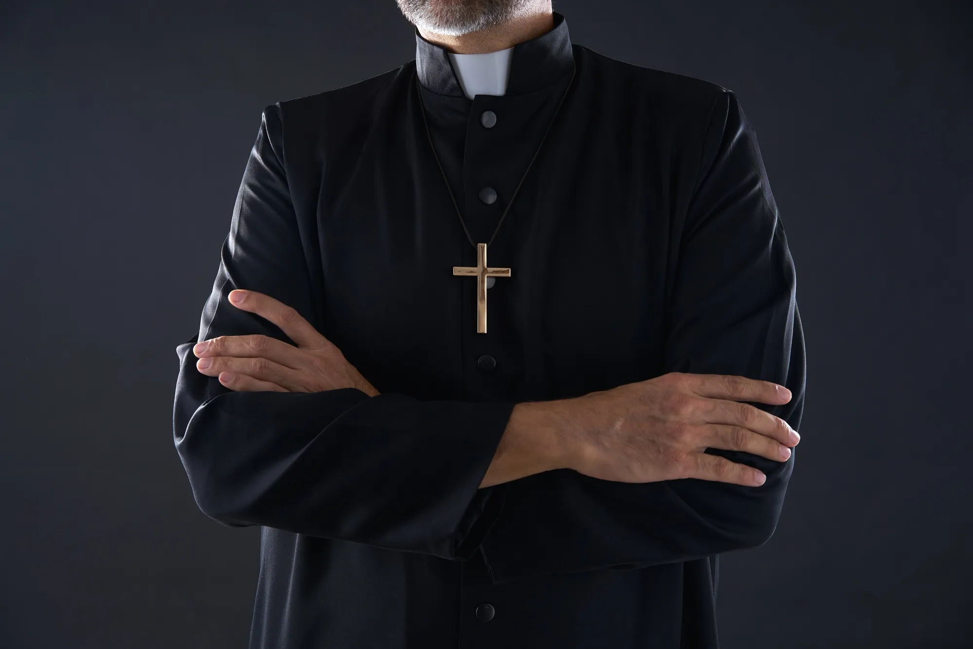 Priest with arms crossed regarding the Catholic Church Appeals to The Supreme Court Over Sex Abuse Lawsuits