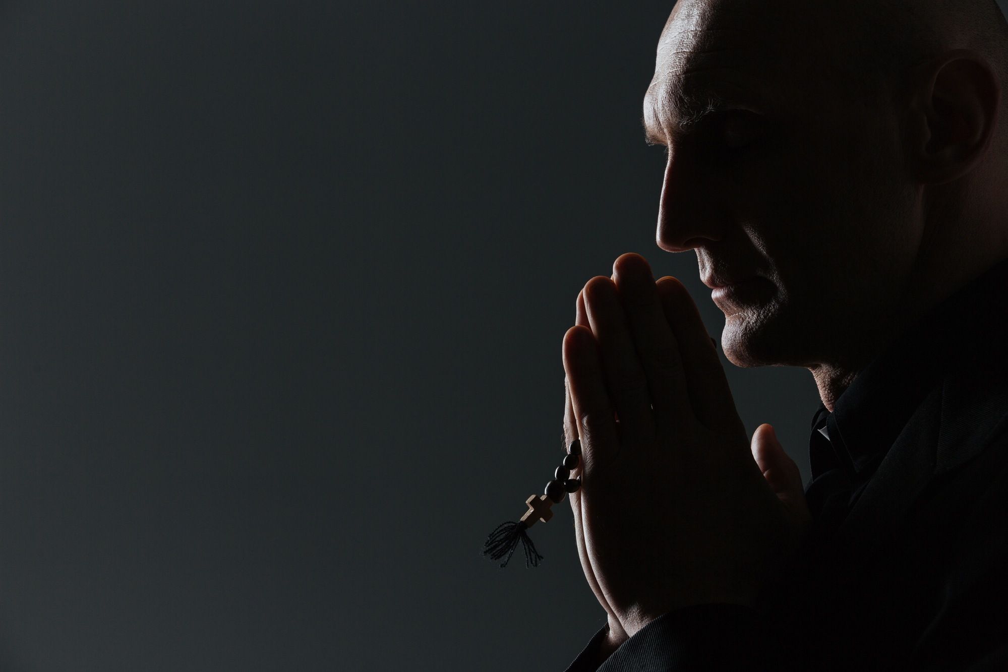 Silhouette of priest regarding the Halifax sex abuse class action lawsuit
