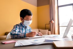 boy learning online due to covid-19