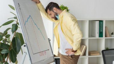 business owner looking at declining profits regarding the business interruption claim denial class action lawsuit