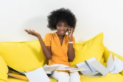 business owner on the phone regarding information on business interruption insurance coverage