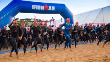 people racing ironman triathlon