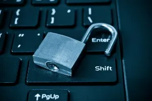 Open silver padlock on black computer keyboard - yahoo