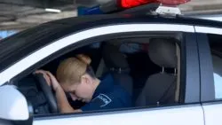 RCMP officer crying in the car regarding the RCMP mental health class action lawsuit filed