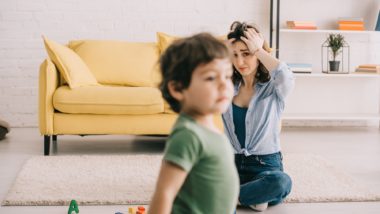 Upset mother with child regarding the sperm bank lawsuit claiming negligence in false sperm donor profile