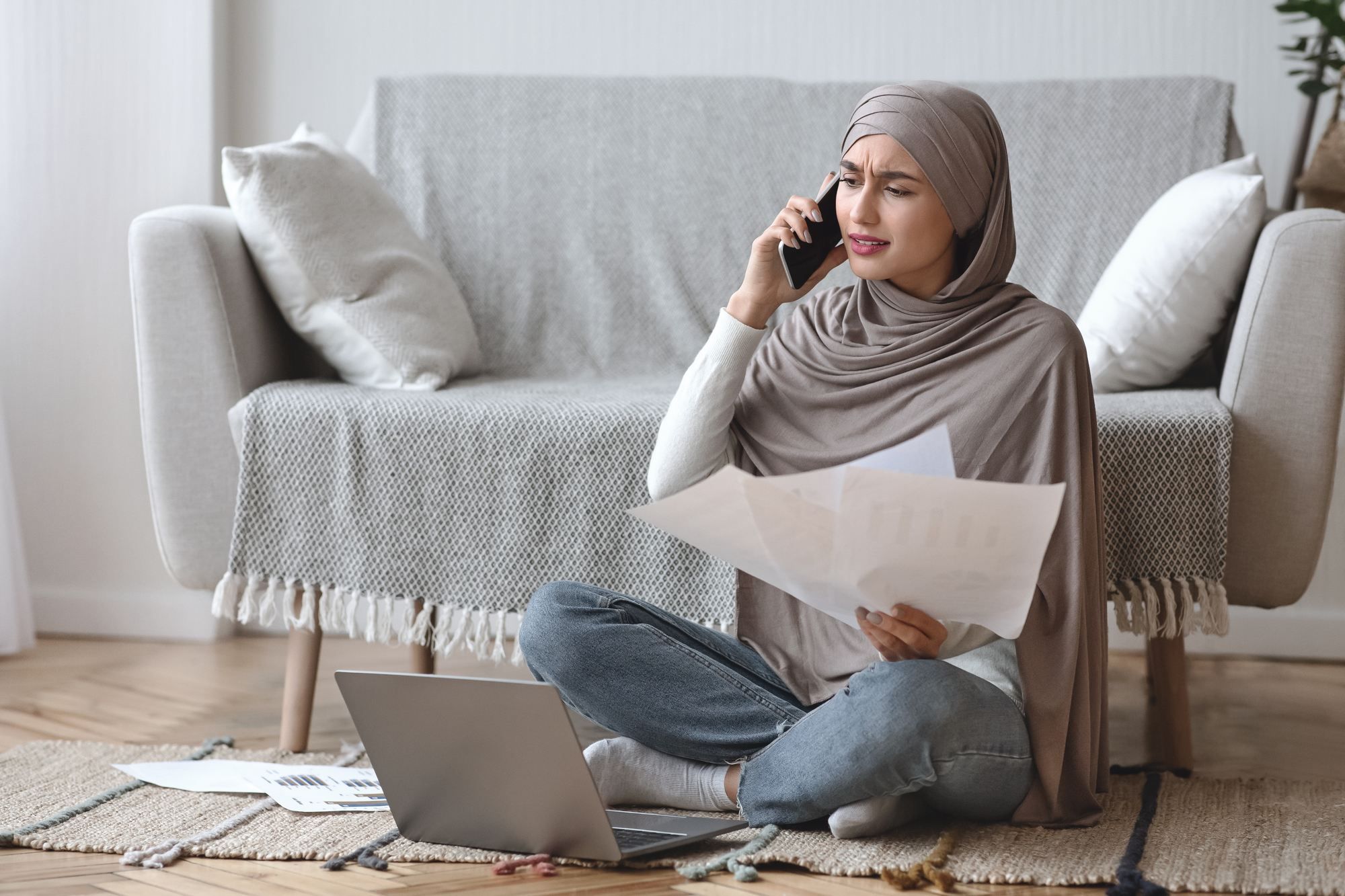 Upset woman on the phone regarding information on why her RBC disability insurance claim was denied