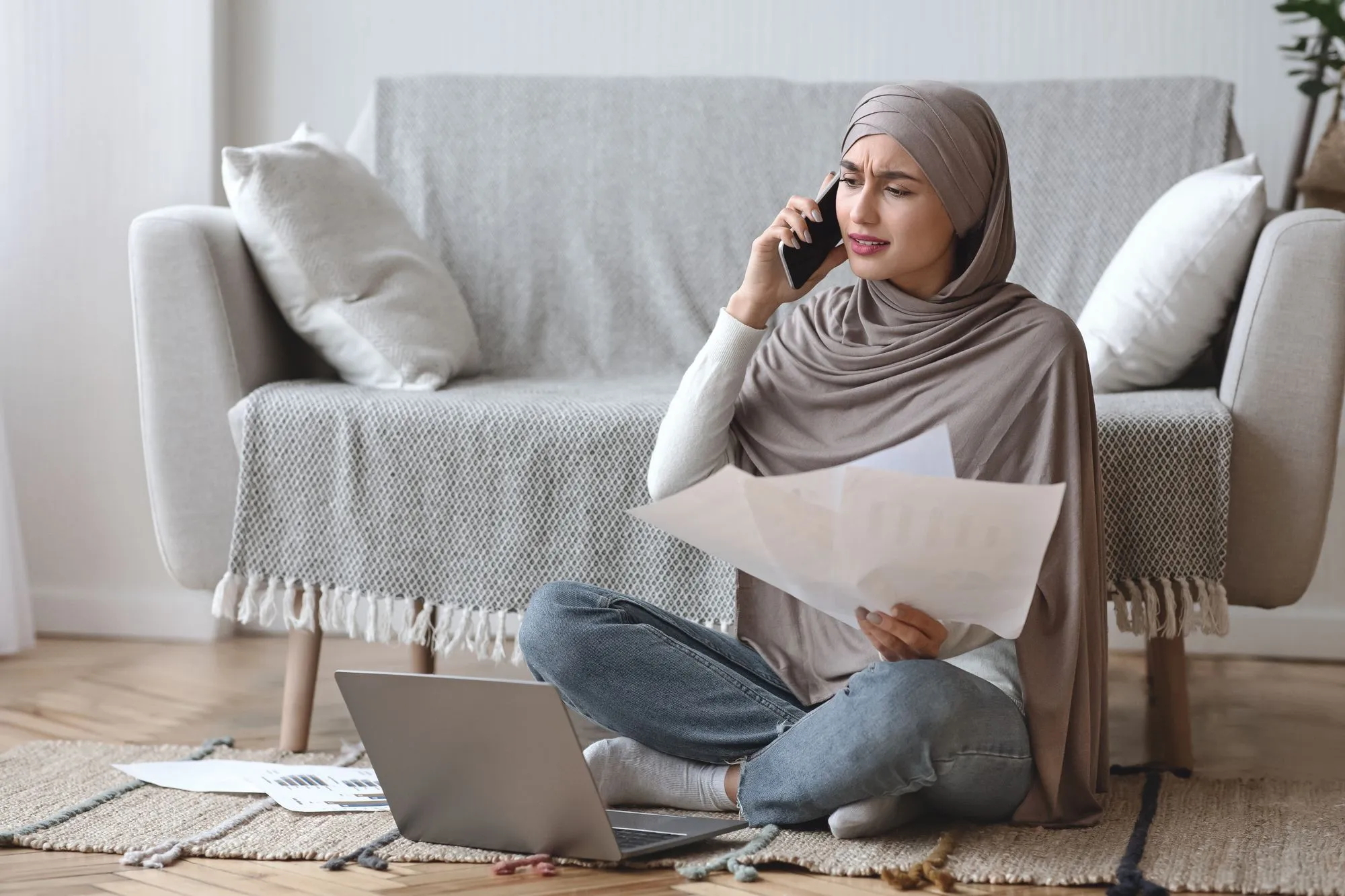 Upset woman on the phone regarding information on why her RBC disability insurance claim was denied