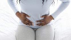 Woman having abdominal pain regarding the transvaginal mesh class action lawsuit settlement