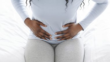 Woman having abdominal pain regarding the transvaginal mesh class action lawsuit settlement