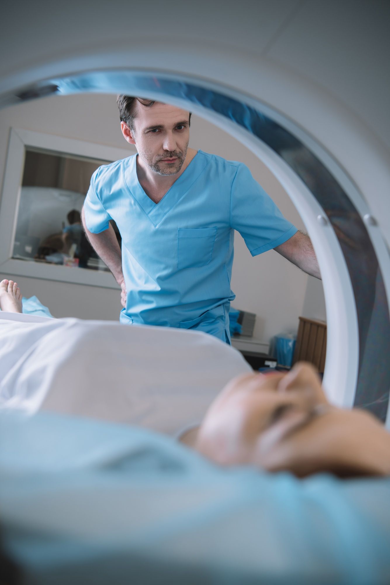 Woman getting an MRI regarding the secret indigenous study class action lawsuit